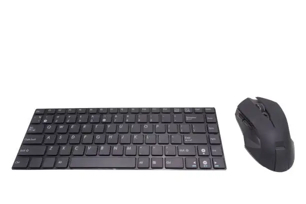 Photo of Computer mouse and keyboard on white background.