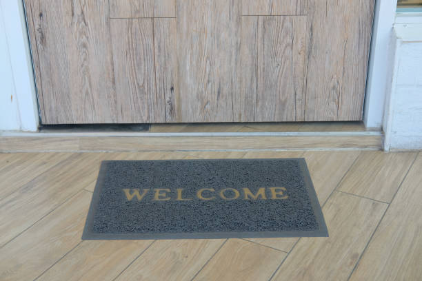 istock Welcome carpet on wooden floor 1014031786