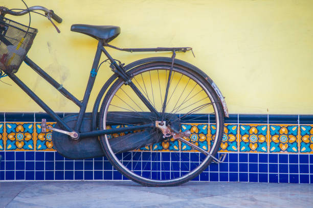 istock Old Blue bicycle on the old street 1014034534