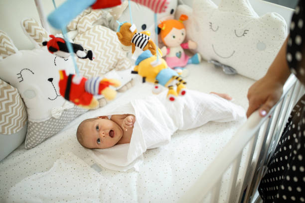 istock Adorable baby girl in a crib 1014037310