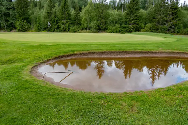 bunker full of water on a golf course in sweden