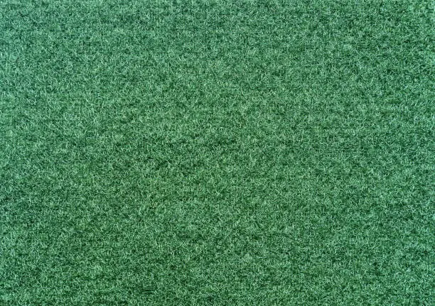 Velcro texture. Green fabric background. Extreme close-up.