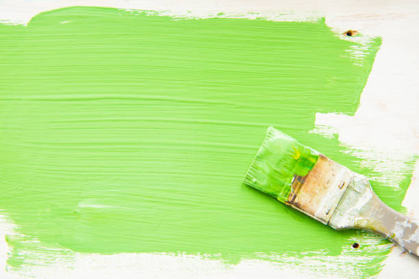 istock Paint brush and green paint. Copy space and top view 1014047274