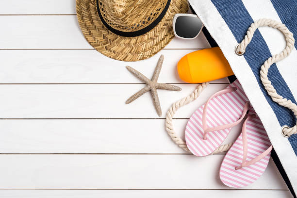 istock Beach accessories on white wooden table. Summer background with copy space 1014047712