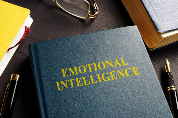 istock Book about Emotional intelligence EI on a desk. 1014050638