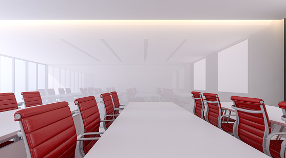 Interior design of seminar room , red chairs and white meeting tables are placed in the room