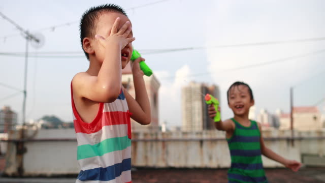 Children playing with squirt gun