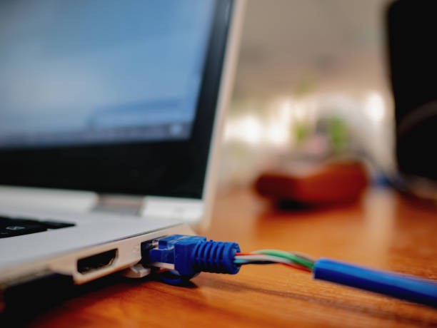 istock Blue color LAN cable Connect to Laptop 1014064966