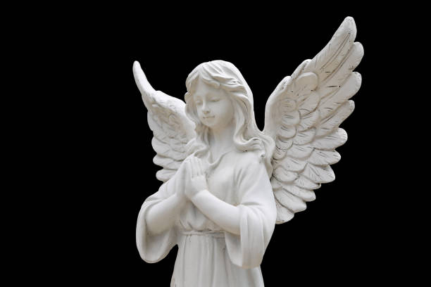 istock Angel statues isolated on black background. 1014065368