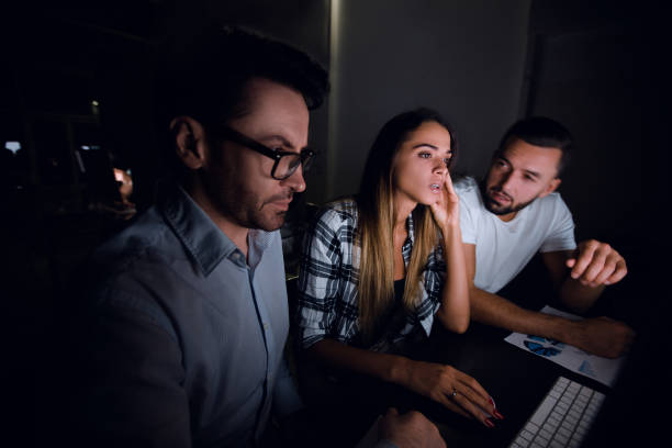 istock business team sitting at the Desk 1014065582
