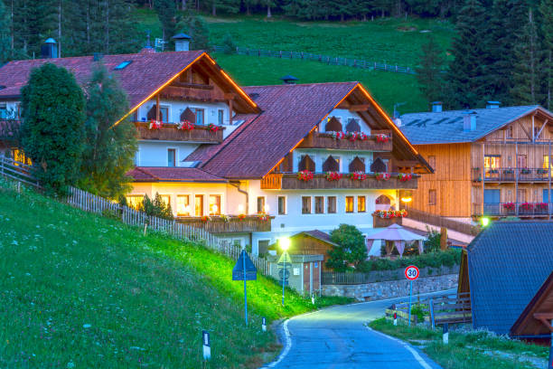 Mountain small hotel restaurant at dusk in Alps village