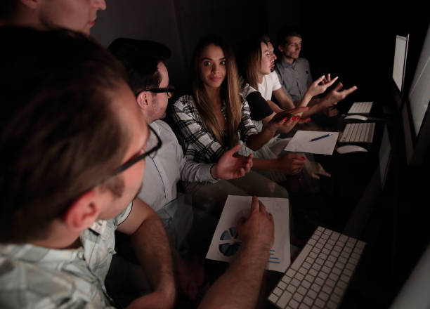 istock business team works in the office at night 1014066342