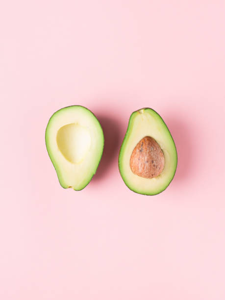 istock Half and full raw avocado minimalism pastel 1014069598