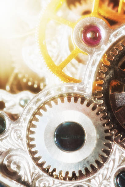 istock Sunlight shining on the inner workings of a clock 1014069894