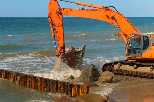 istock coastal protection measures, construction equipment on the shore, the construction of breakwaters 1014070064