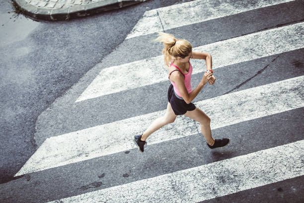 istock Female Athlete Runnin in Urban Environment 1014080538
