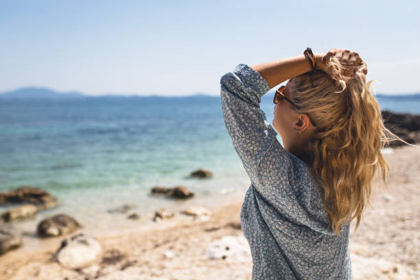 istock Lady enjoying the fresh sea air 1014080840