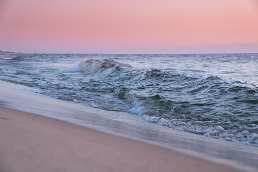 The Baltic sea shore in sunset. Pastel toned image