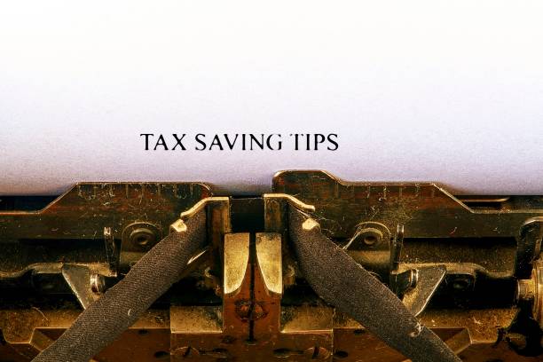 istock Closeup on vintage typewriter. Front focus on letters making TAX SAVING TIPS text. Business concept image with retro office tool 1014086474