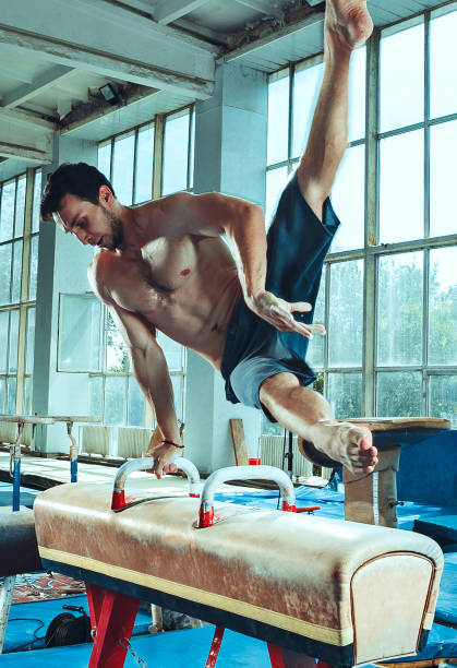 istock The sportsman during difficult exercise, sports gymnastics 1014093092