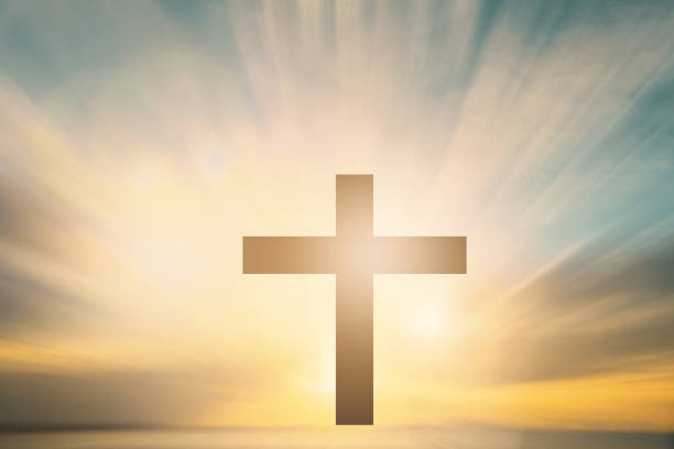 istock Jesus christ mercy at cross on mountain sunset background 1014103514