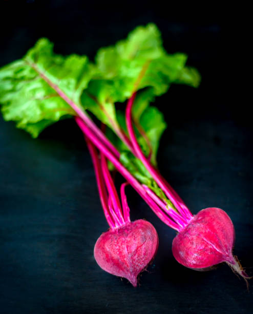 istock Beetroot cut in half on a black background, place for text, healthy food Copy space. Top view 1014103598