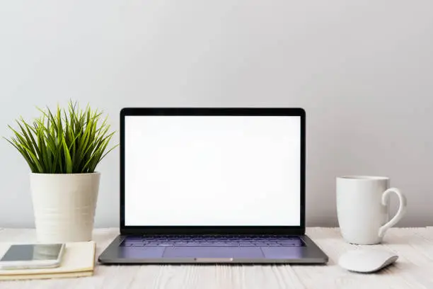 Photo of Close-up picture of a keyboard with a phone and computer laptop technology