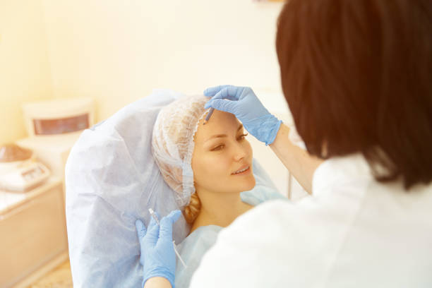 istock Doctor - beautician holds reception 1014126370