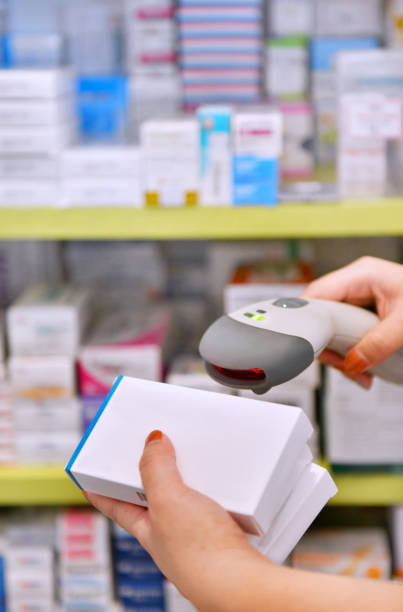 istock Pharmacist scanning barcode of medicine 1014126974