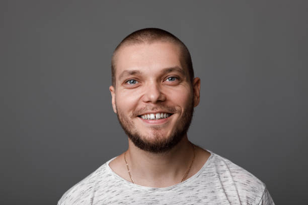 istock portrait of young smiling man 1014127086