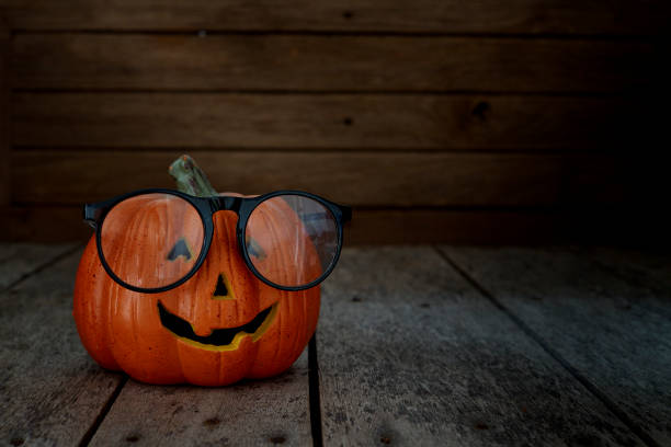 istock jack-o-lantern on wooden background 1014127624