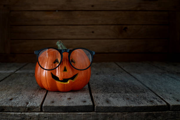 istock jack-o-lantern on wooden background 1014127630