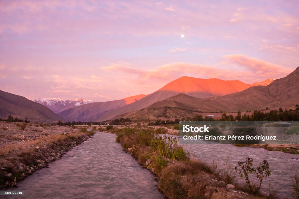 View of the Andes mountain range as seen from Vicuña in the Elqui Valley during the sunset sunrise in Chile Atacama Desert Stock Photo