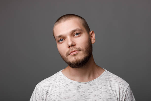 istock portrait of calm young man 1014130194