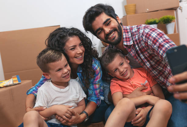 istock Happy young family having fun while moving into their new home. 1014130474