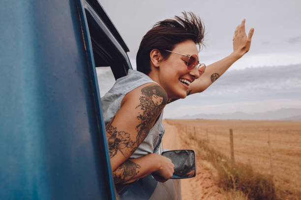 istock Beautiful woman enjoying road trip 1014138326