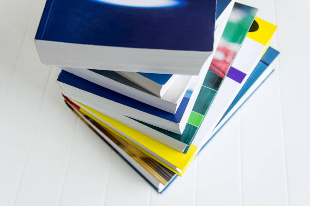 istock Stack of new colorful books is on the white table. Concept-Back to school, education. 1014139400