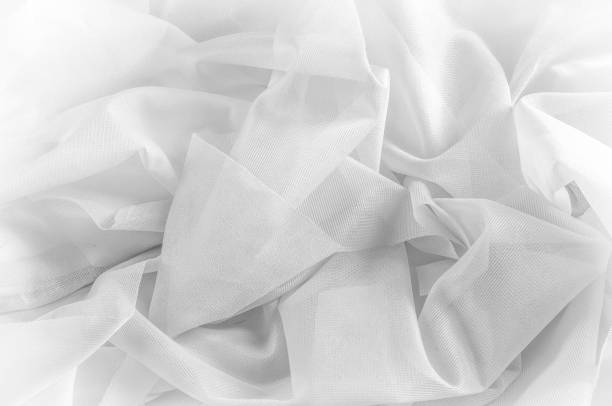 istock Texture, background, pattern. Texture of silk fabric - White. Silk fabric is transparent. Fabric or liquid wave illustration wavy creases of silk satin texture or velvet material or white 1014139442