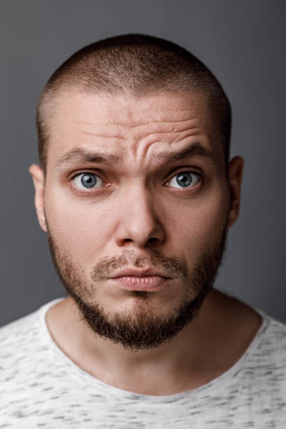 istock portrait of a young wary man 1014147590