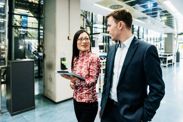 istock Printing Factory Operations Manager Speaking With Colleage 1014149990