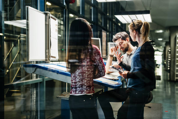 istock Team Of Engineers Working Together At Desk 1014150688