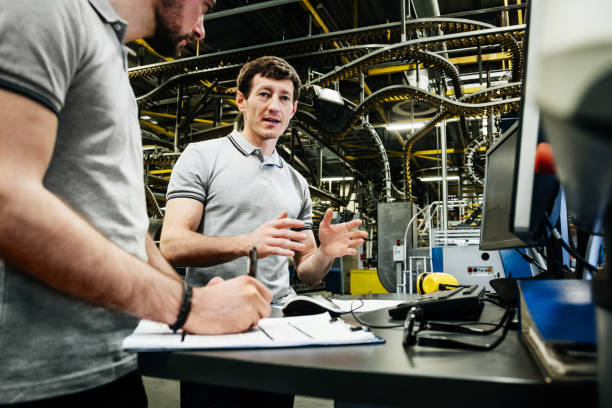 istock Engineers Working Together At Printing Factory 1014151726