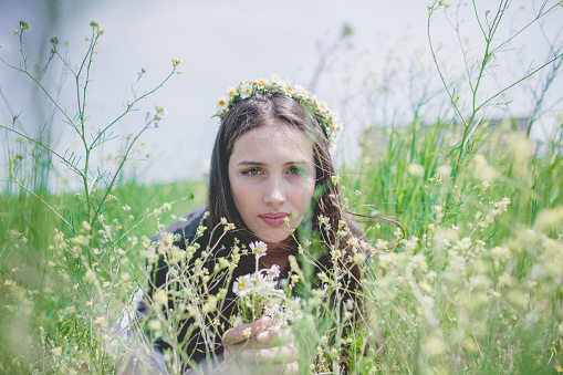 female model photography between flowers