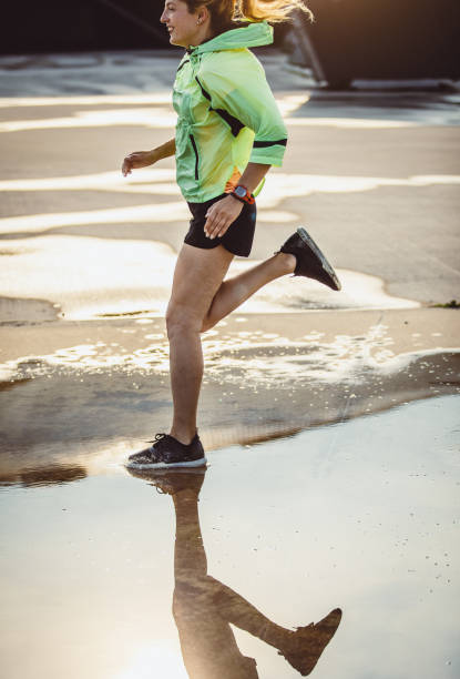 istock Female Athlete Running in Urban Environment 1014163884