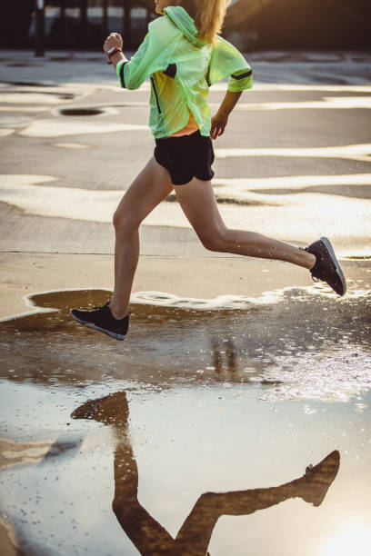 istock Female Athlete Running in Urban Environment 1014163892