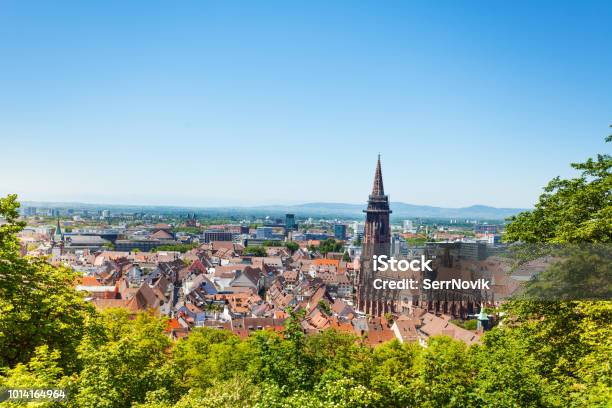 Freiburg Cityscape With Munster Against Blue Sky Stock Photo - Download Image Now - Freiburg im Breisgau, Freiburg Minster, Nature