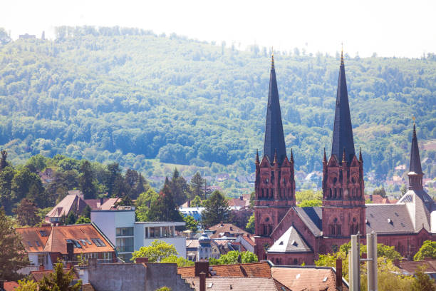 Cityscape of Freiburg im Breisgau with church of St. John in the foreground, Germany, Europe