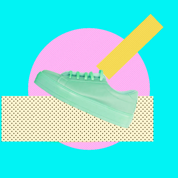 istock Turquoise sneaker on a pink circle and traces of paint. 1014178186