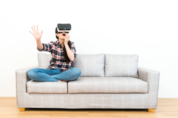 istock beauty young girl wearing 3D virtual reality 1014181748