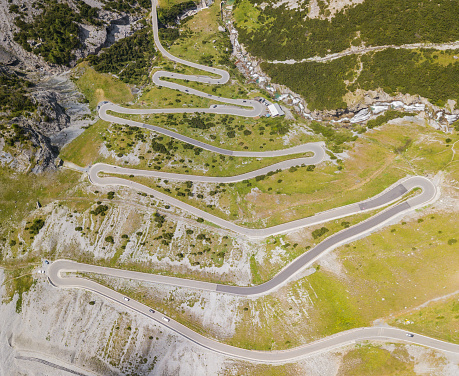 Road to the Stelvio mountain pass in Italy. Up and down amazing aerial view of the mountain bends creating beautiful shapes
